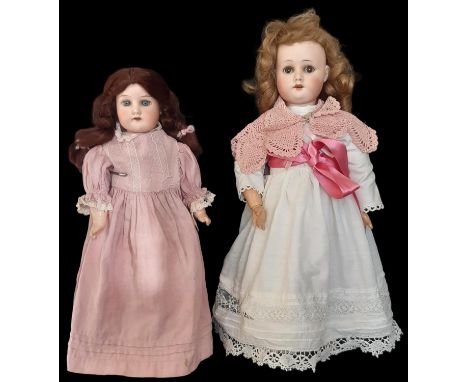 Two early 20th century German bisque head dolls comprising a shoulder head doll by Armand Marseille mould 370 with closing bl