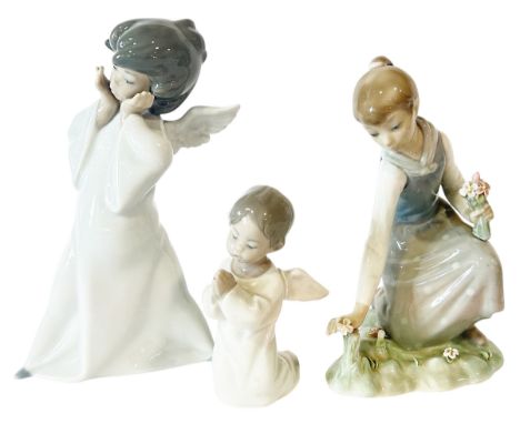 Three Lladro figures, two of angels, further of a girl picking flowers (3)