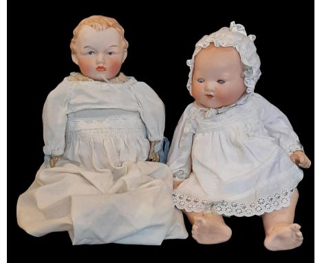 Two early 20th century bisque head baby dolls comprising an English made shoulder head doll by Empire Porcelain Company (Stok