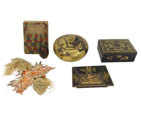 A gold and black lacquered playing card box, a Japanese cherry blossom decorated gold lacquered bowl with lid, a Cowslip book