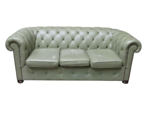 A Victorian style button Chesterfield on bun supports, in a pale green leather, 2m wide approx