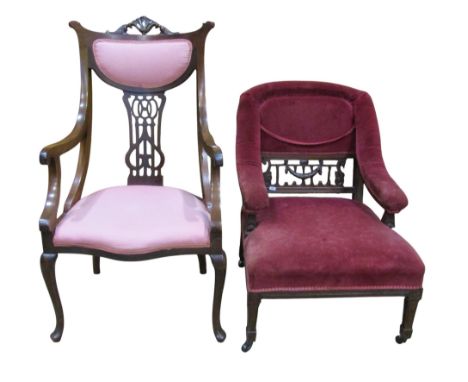 An Edwardian drawing room chair and one other with pierced and carved detail (2) 