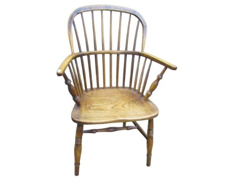 A 19th century Windsor hoop back armchair in mixed woods, principally ash and beech