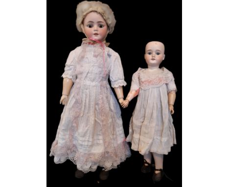 Two early 20th century German bisque head dolls by Shoenau &amp; Hoffmeister both with closing eyes and jointed body in perio