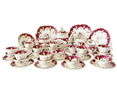 A 19th century Rockingham style porcelain tea service with hand painted floral bouquets within plum and gilt borders comprisi