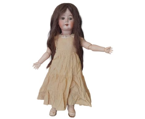 Early 20th century bisque head doll by Walther &amp; Sohn mould 120-9 with closing brown eyes, open mouth with teeth, jointed