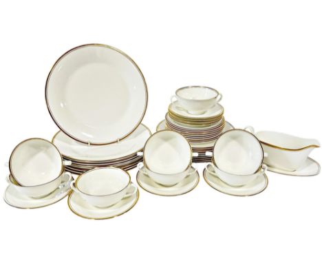 A collection of Royal Doulton Gold Concord pattern porcelain dinner wares comprising eight dinner, side and smaller plates, e