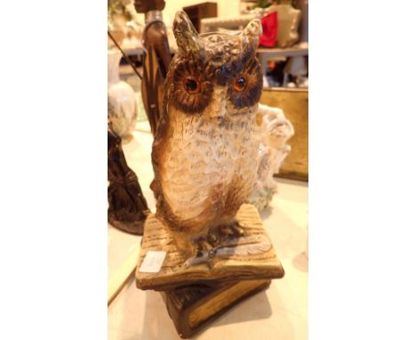 Ceramic Owl perched on an open book