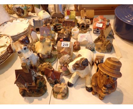 Large quantity of minature ceramic and chalkware cottages etc 