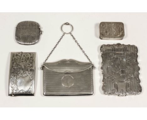 An early Victorian silver rectangular visiting card case of shaped outline engraved with a basket of flowers, C and S-scroll 