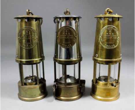 A Type 6 chrome and brass miner's lamp by The Protector Lamp and Lighting Company Ltd, Eccles, with two attached brass tags, 