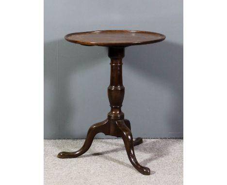 A mahogany circular tray top tripod occasional table on heavy turned central column and cabriole supports, 21.5ins diameter x