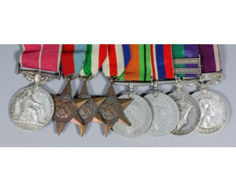 A group of seven medals comprising, George V British Empire Medal, George VI 1939 - 45 Star, Italy Star, France Germany Star,