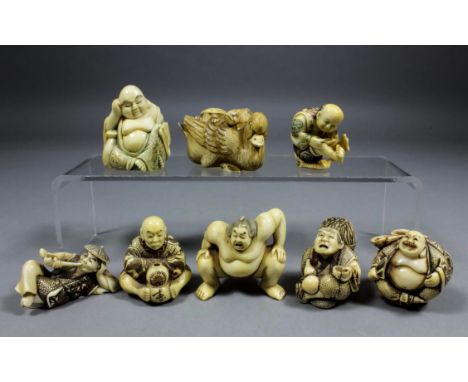 A Japanese ivory netsuke of a Sumo Wrestler, 2ins (51mm) high, signed, and seven other ivory netsukes, various