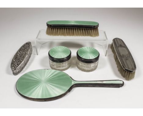 An Edward VIII silver and green enamel backed four piece dressing table set with engine turned backs, comprising - hand mirro