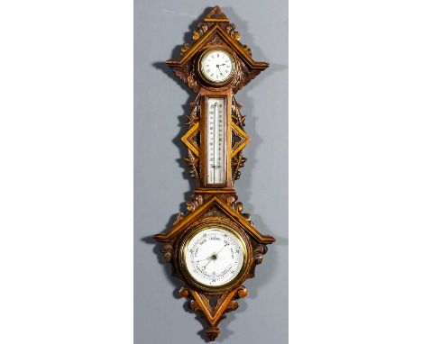 A late Victorian oak cased aneroid barometer, thermometer and timepiece, the barometer with 4.5ins white glazed pottery dial,
