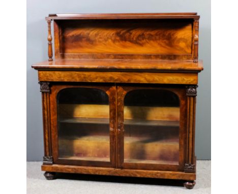 A William IV mahogany chiffonier, the upper part with tray top shelf and reeded edge, on slender baluster turned and fluted s