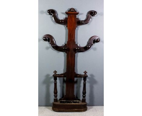 A Victorian mahogany hall stand, the rectangular central support with four shaped brackets with ten turned wood hat and coat 