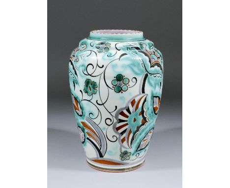 An early 20th Century Carter Stabler Adams Poole pottery vase painted in greens, browns and blacks with stylised flowering br