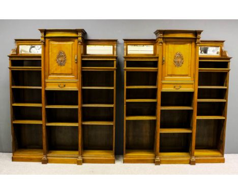 Two late Victorian walnut break-front bookcases by W. Walker & Sons, Bun Hill Row, EC, the central sections with moulded bow-