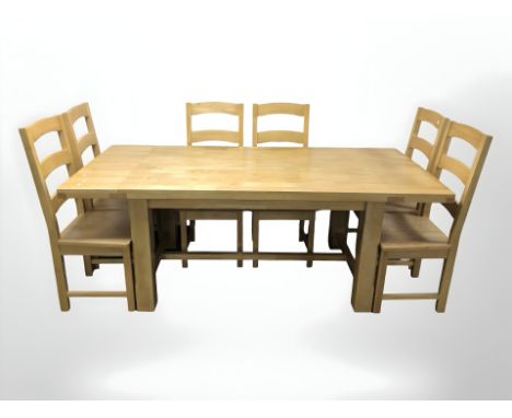 A modern pine extending dining table, extended 200 cm x 90 cm x 75 cm, and a set of six ladder back chairs.