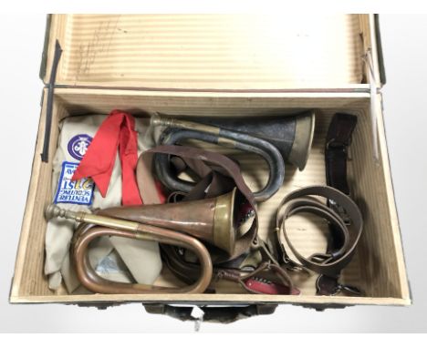A vintage suitcase containing two bugles, a Swiss army knives, boys brigade leather belts and uniform, etc.