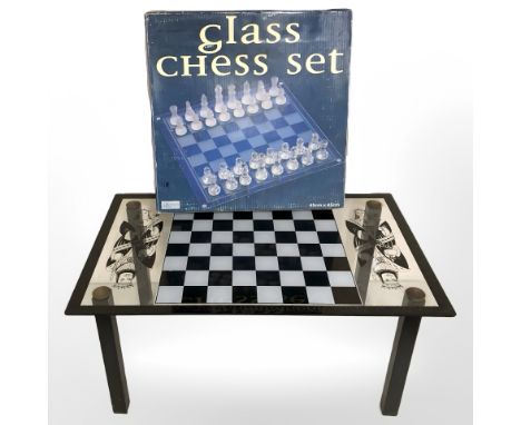 A chessboard coffee table, width 75 cm, and a glass chess set.