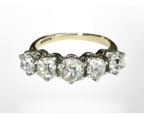 An 18ct yellow gold five stone old brilliant cut diamond ring, size L, 4.1g. CONDITION REPORT: We are not diamond graders but