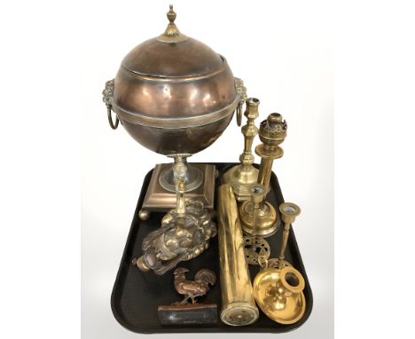A Victorian copper and brass globular samovar, a lion mask door knocker, several candlesticks and an oil lamp, an inert brass