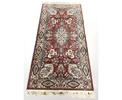 A machine made runner of Persian design, 361 cm x 91 cm.