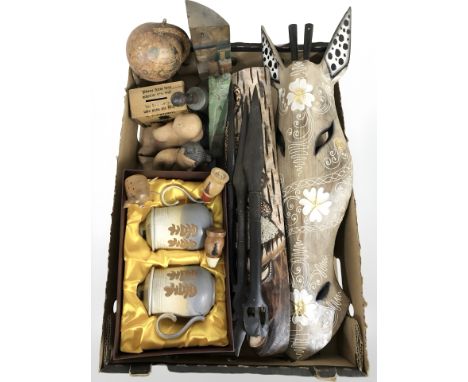 A group of dolls, decorative Eastern style masks, figures, miniature globe, treen money box, etc. (2 boxes)