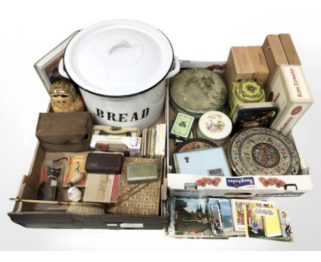 An enameled bread bin, babushka doll, vintage camera, tins, cigar boxes, etc. (2 boxes)