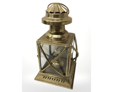 A brass hanging oil lantern, height 30 cm including handle.