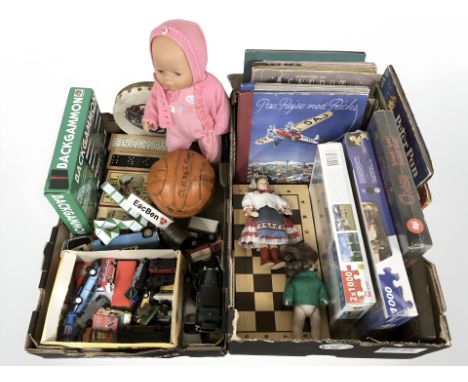 A group of puzzles, chessboard, die cast cars, dolls, several volumes. (2 boxes)