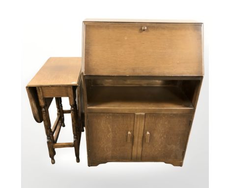 An oak fall front bureau, width 76 cm, and an oak gate leg table.