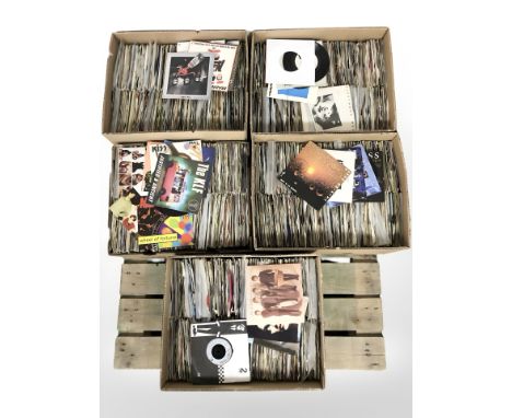 A very large quantity of vinyl 7" singles including The Beatles, Kiss, The Who, Madness, Fleetwood Mac, U2, David Bowie and m