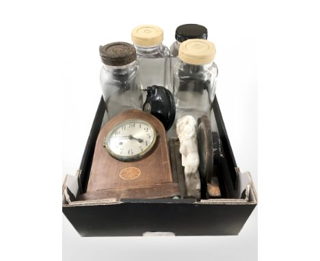 A group of brass ornaments, glass storage jars, two mantle clocks, inert brass shells, two oil lamps. (2 boxes)