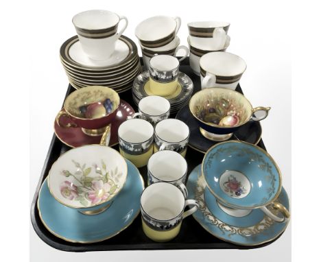 A group of Aynsley porcelain tea cups and saucers, Foley coffee cans and saucers on yellow ground, and fifteen pieces of Roya