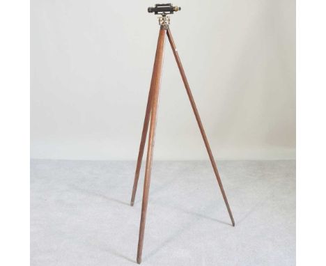 A mid 20th century Stanley surveyors' theodolite, on a tripod base, 150cm high
