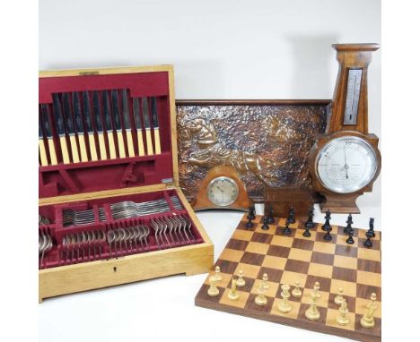 A wooden chessboard and set, together with a canteen of cutlery with faux ivory handles, a mahogany mantel clock with inscrip