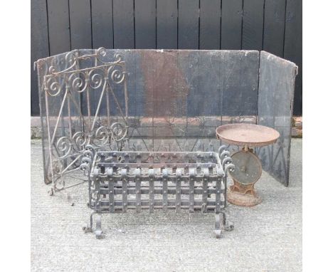 A wrought iron fire grate, 75cm wide, together with a fire screen, a spark guard and a set of scales (4)