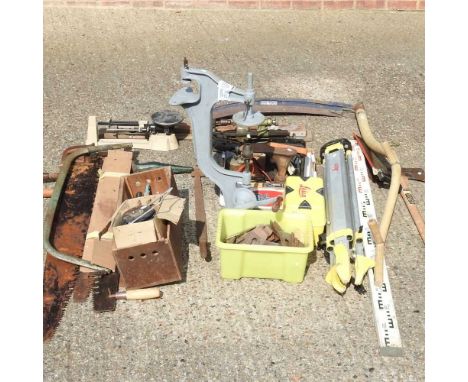 A collection of hand tools, to include a theodolite