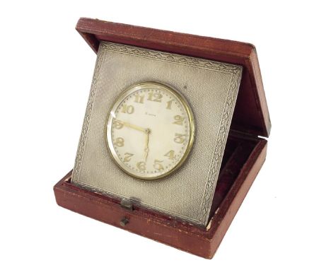 Silver eight day strut clock timepiece, the 2" silvered dial within an engine turned surround, hallmarked London 1923, also b