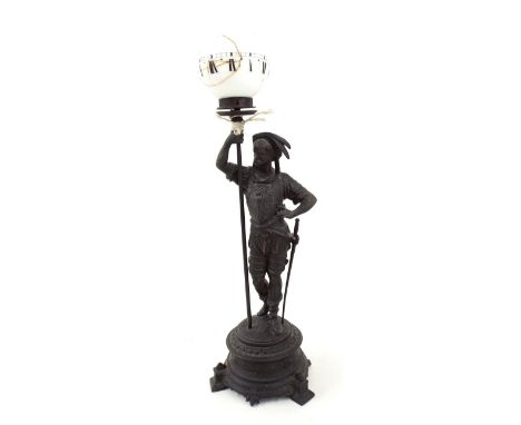 Spelter figural night clock modelled as a standing soldier upon an ornate circular stepped base, 21.5" high (shade a.f)