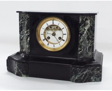 Black slate and green marble two train mantel clock striking on a bell, the 3.5" white chapter ring enclosing a recessed visi