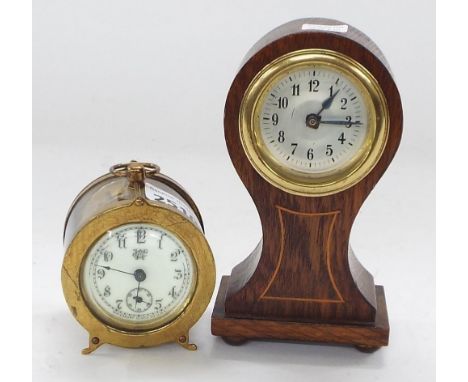 Small brass cased patent alarm timepiece, the back plate and 2" cream dial with subsidiary seconds dial signed Waterbury Cloc