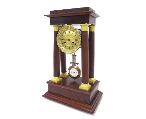 French mahogany portico two train mantel clock, the movement striking on a bell, the 4" gilded chapter ring enclosing a flora