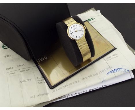 IWC 18ct yellow gold lady's bracelet watch, circa 1975, ref. F4107, circular white dial with black Arabic numerals, ser. no. 