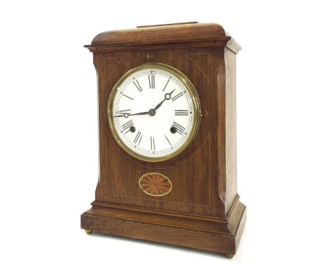 American oak inlaid two train mantel clock, the movement striking on a gong, the 5.5" white dial within a stepped case surmou