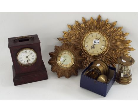 Two Smiths eight day gilt sunburst wall clocks, stained wooden single train mantel clock and two brass cylindrical ticket clo